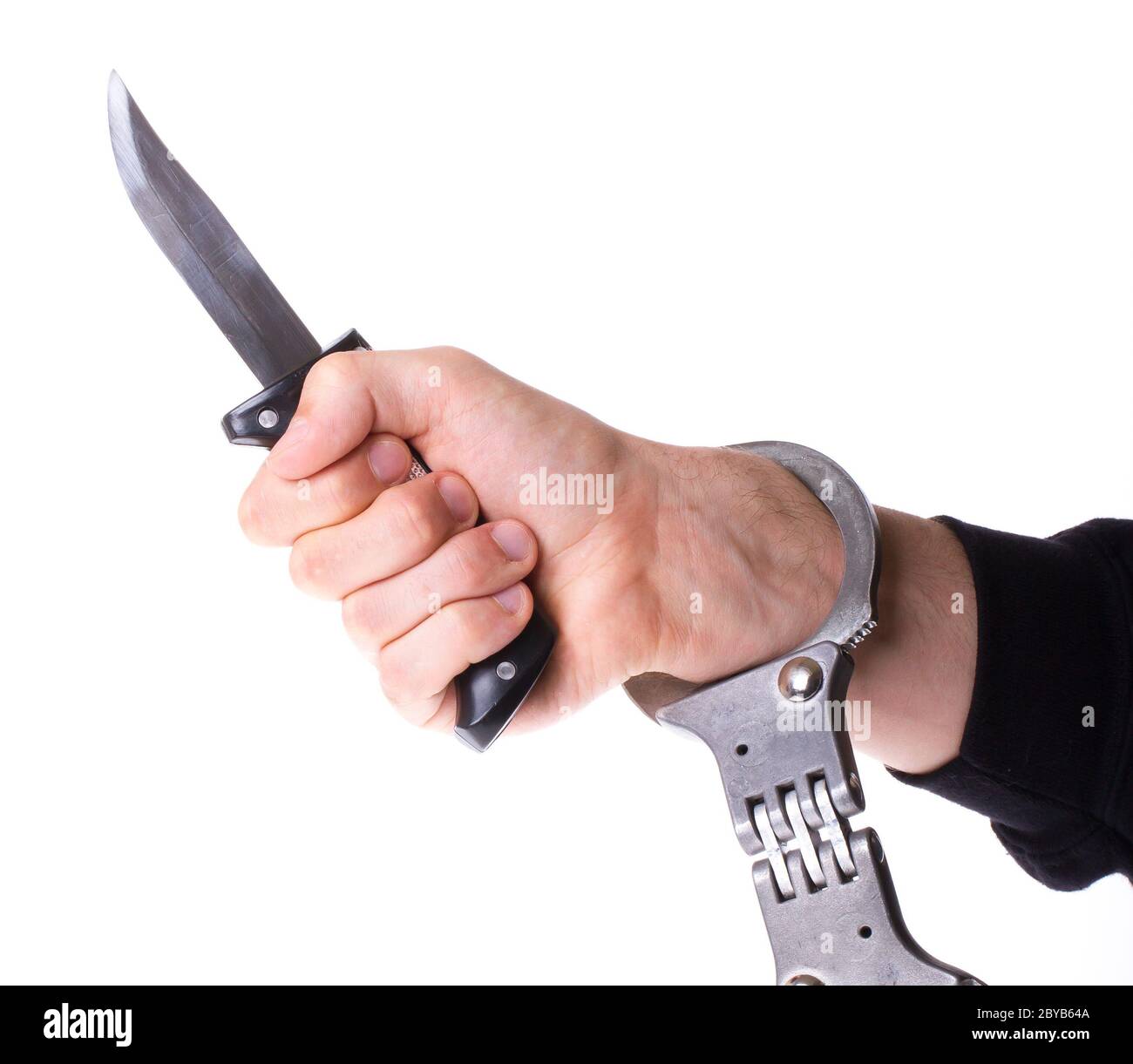 Male with a sharp knife in it's hand with a handcuff Stock Photo