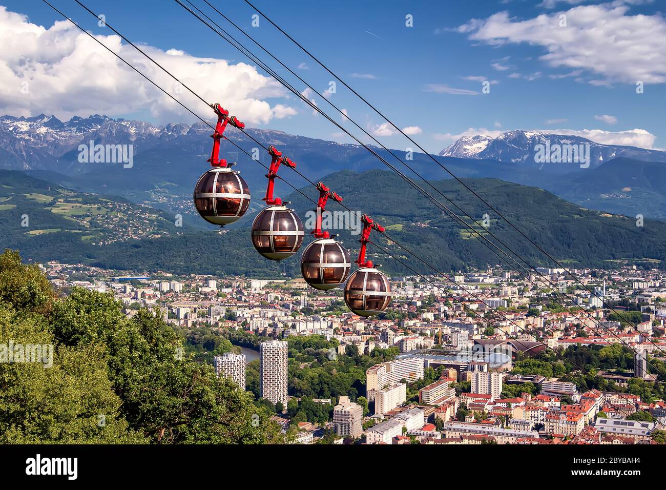 Picturesque aerial view on cable way and city. Grenoble, France. Grenoble-Bastille cable car on the foreground Stock Photo