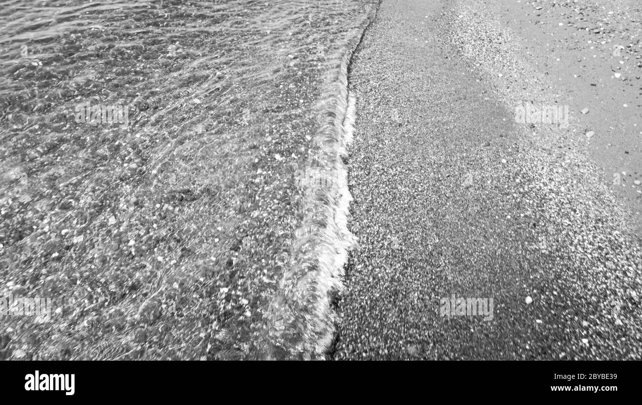 Ocean waves smooth beach Black and White Stock Photos & Images - Alamy