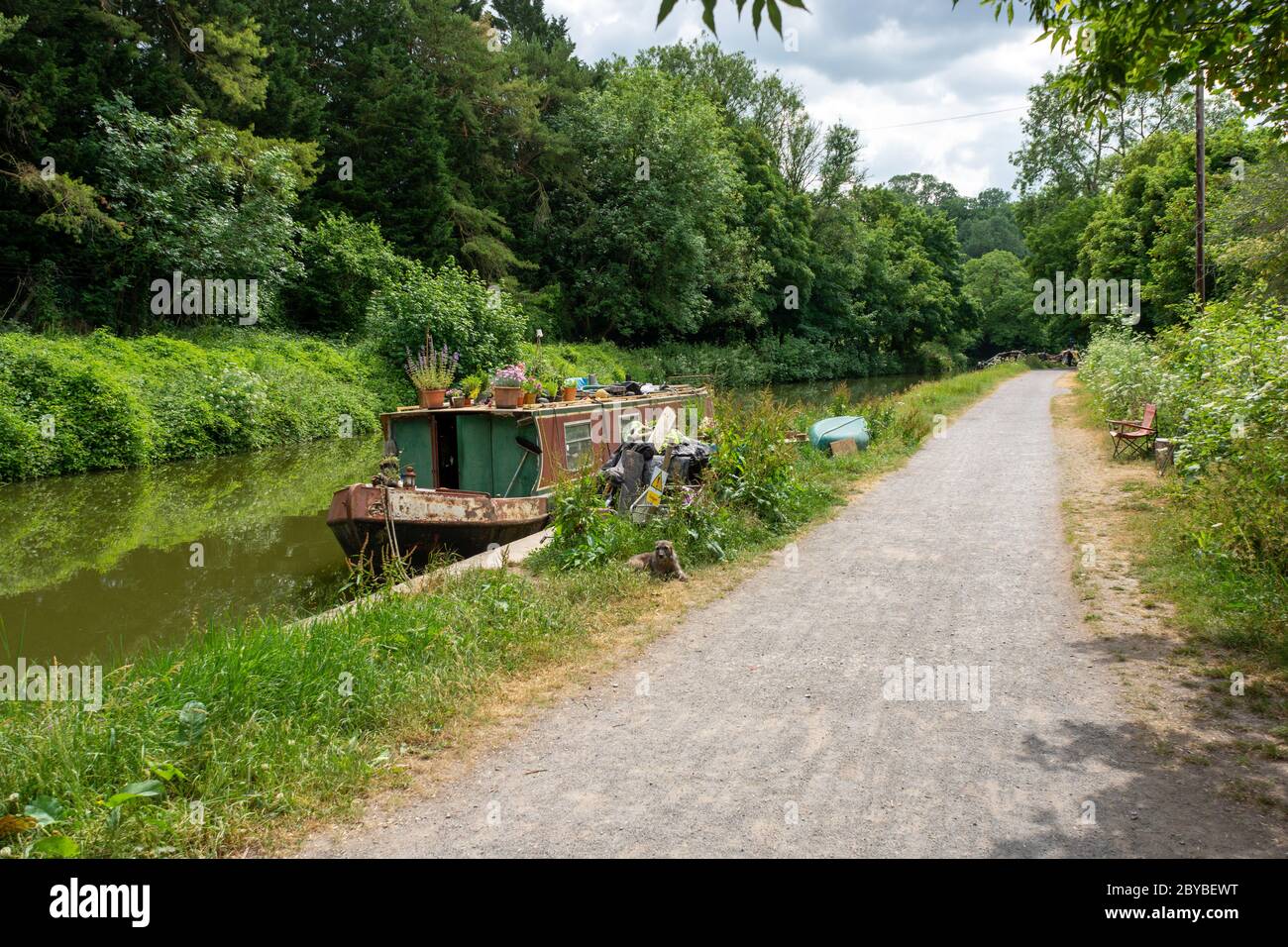 Old narrowboat and toe path of Kennet & Avon Canal at Bradford-on-Avon, Wiltshire, UK Stock Photo