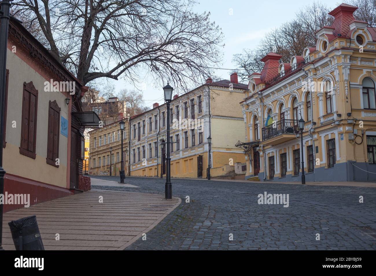 Kiev, Ukraine - March 26, 2020: Old architecture and cobblestone road on St. Andrew's Descent in the center of Kiev. Stock Photo