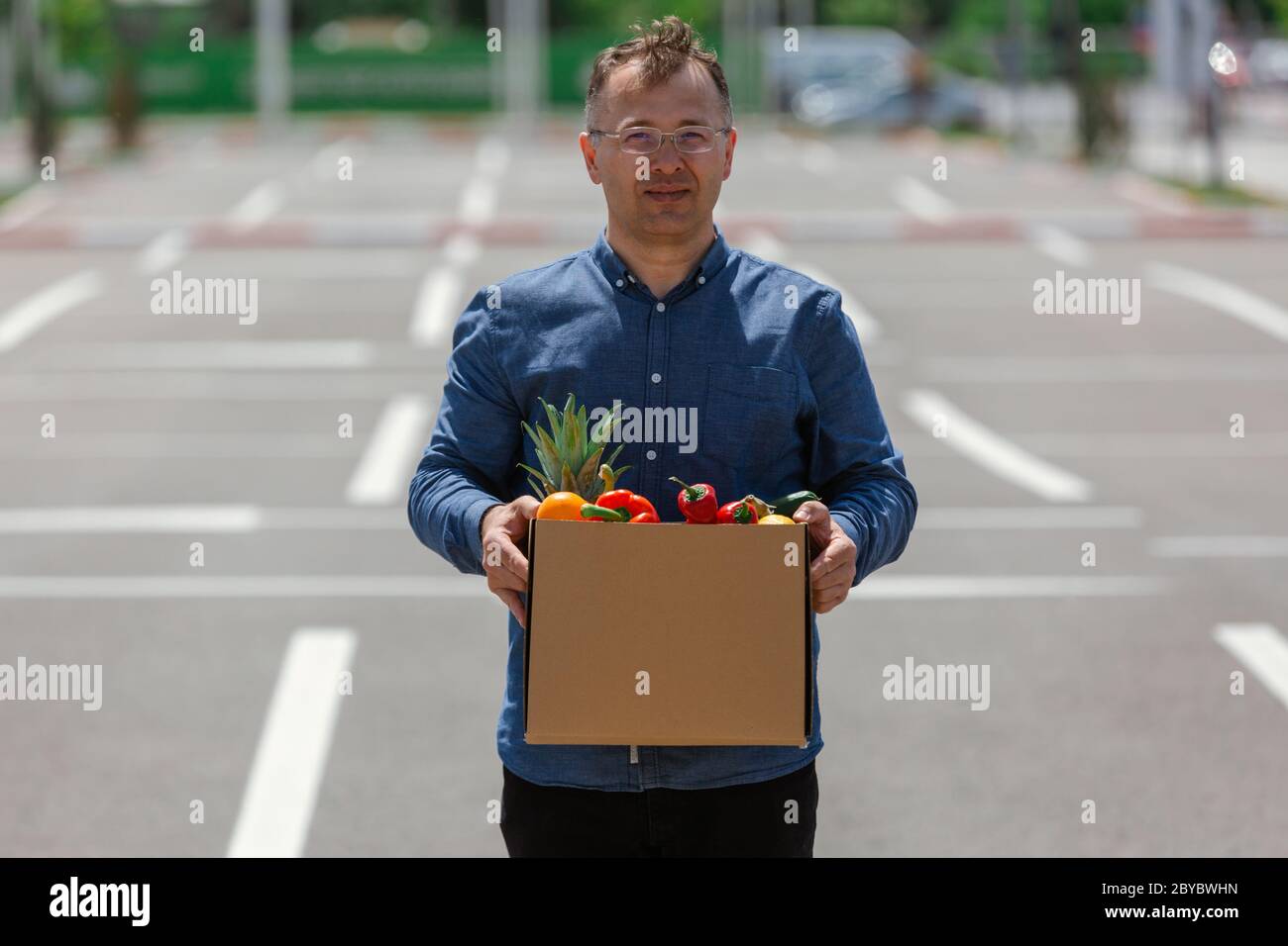 Delivery man holding a food box, food delivery man Stock Photo