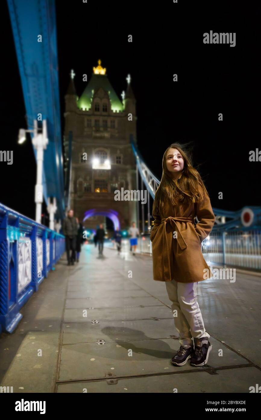 London, UK - February 2020: Happy Teenager on Tower Bridge in London during the Holidays Stock Photo