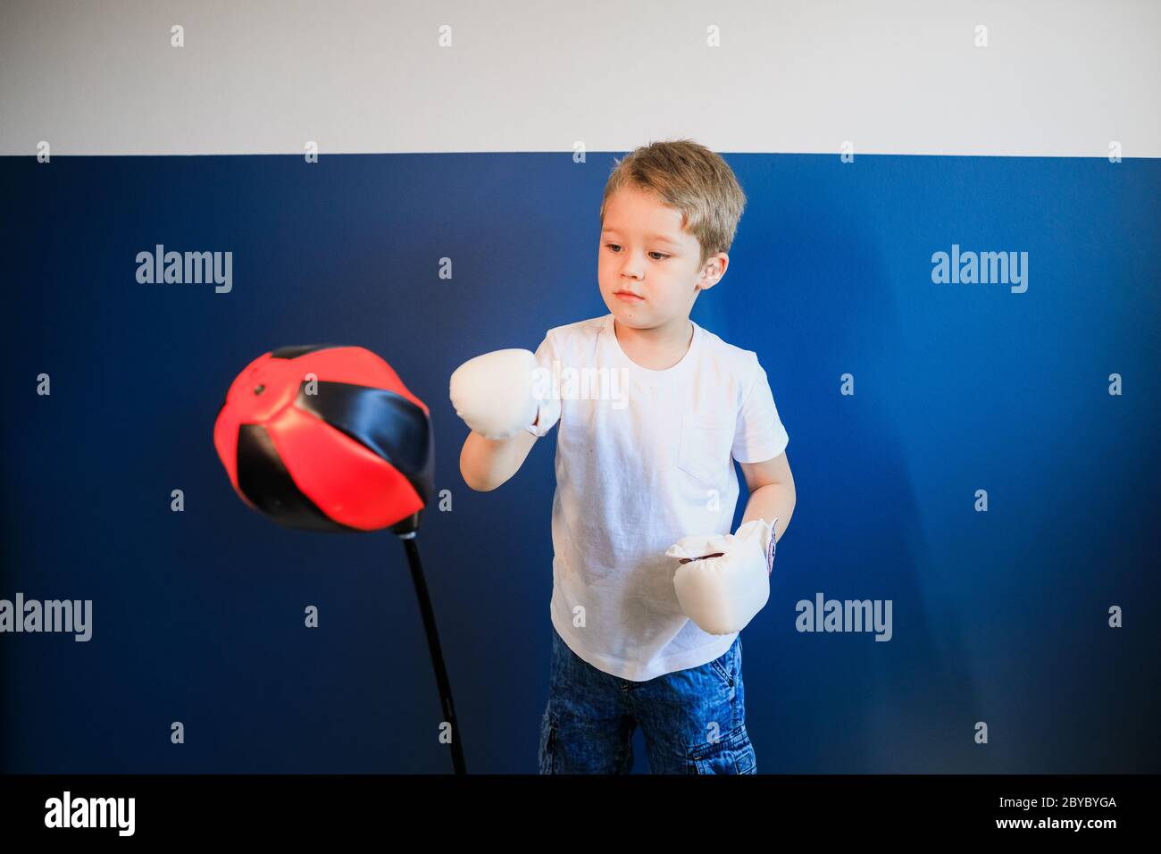 Young boy Boxing at home during self-isolation Stock Photo