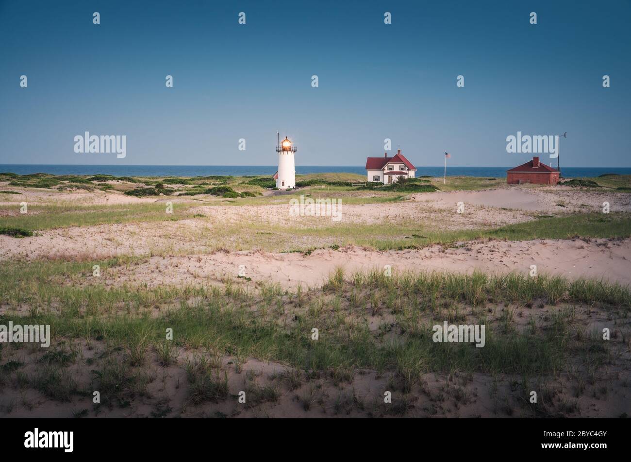 Race Point Light Lighthouse in beach dunes on the beach at Cape Cod, New England, Massachusetts Stock Photo