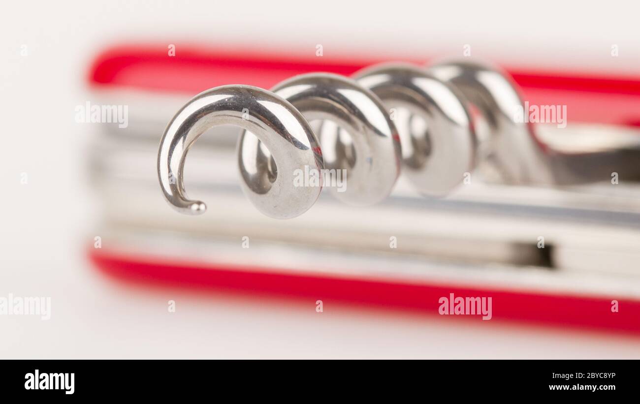 Red swiss army knife isolated, focus on corkscrew Stock Photo Alamy