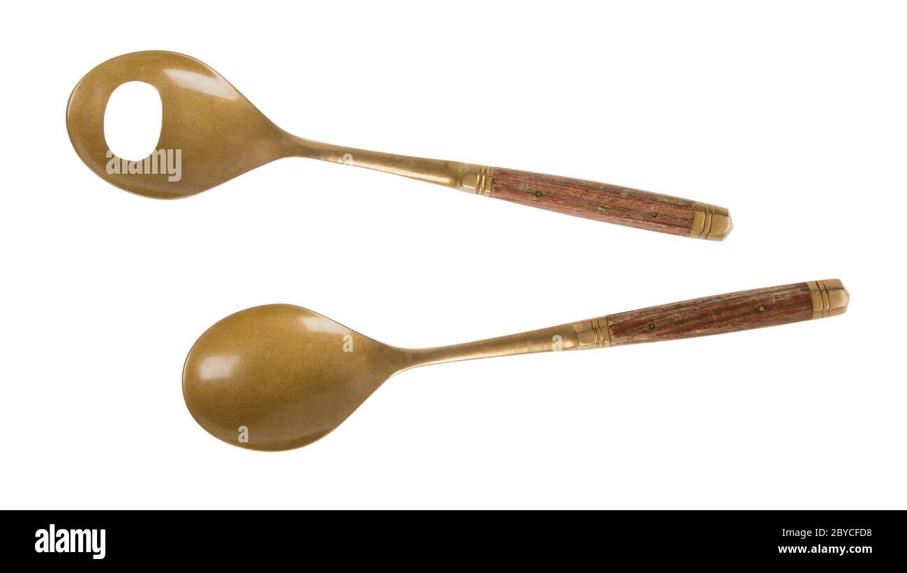 Old brass serving spoons isolated Stock Photo Alamy