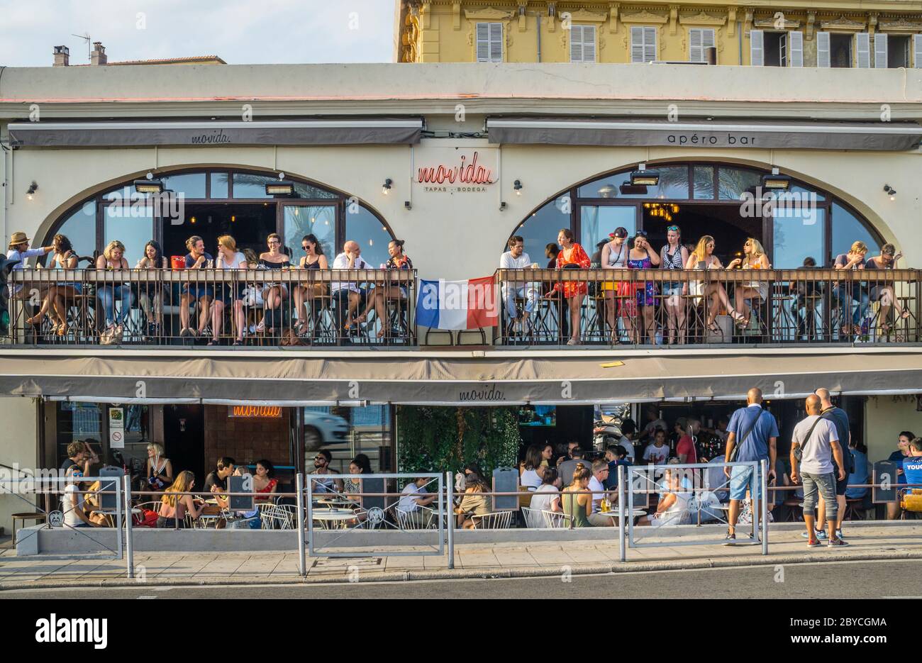 popular Movida Bar at Quai des Etats-Unis on the Nice waterfront, French Riviera, Provence-Alpes-Côte d'Azur, France Stock Photo