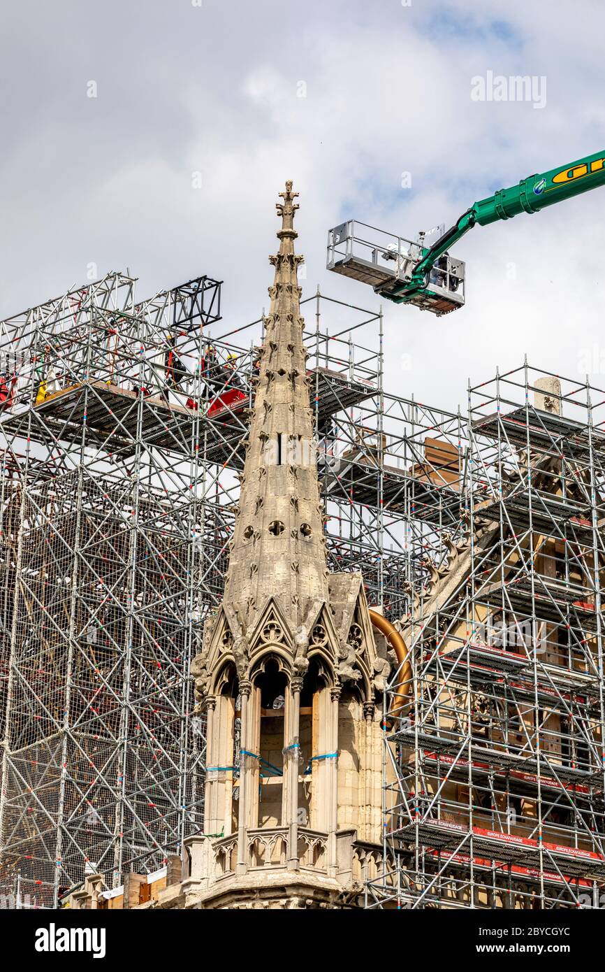 Paris, France - June 9, 2020: Workers begin dismantling the scaffolding, 1 year after the Notre-Dame cathedral fire in Paris Stock Photo