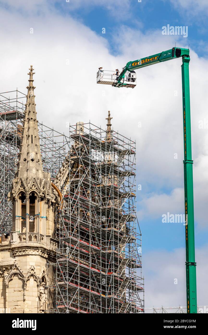 Paris, France - June 9, 2020: Workers begin dismantling the scaffolding, 1 year after the Notre-Dame cathedral fire in Paris Stock Photo