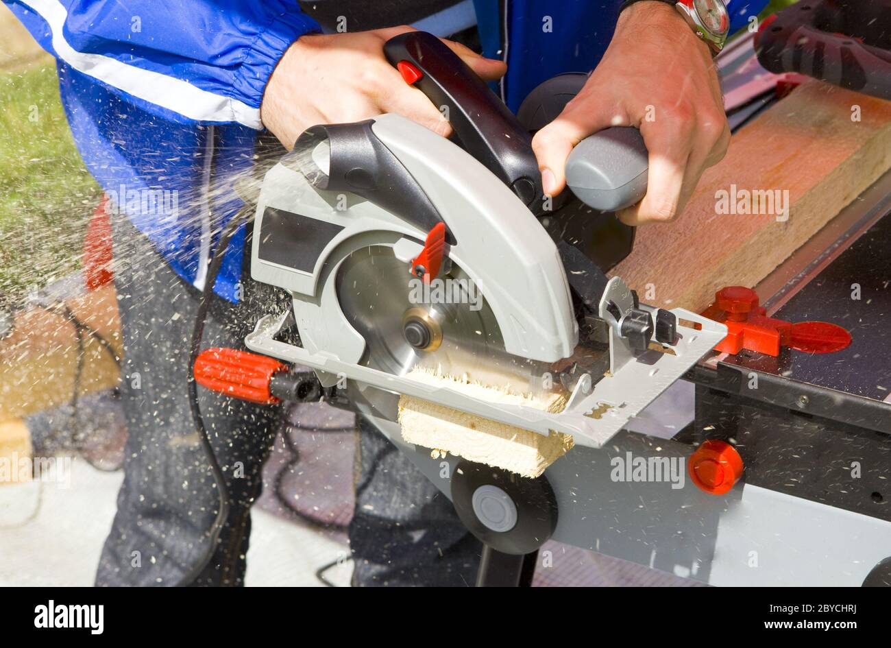 Man works circular saw Stock Photo - Alamy