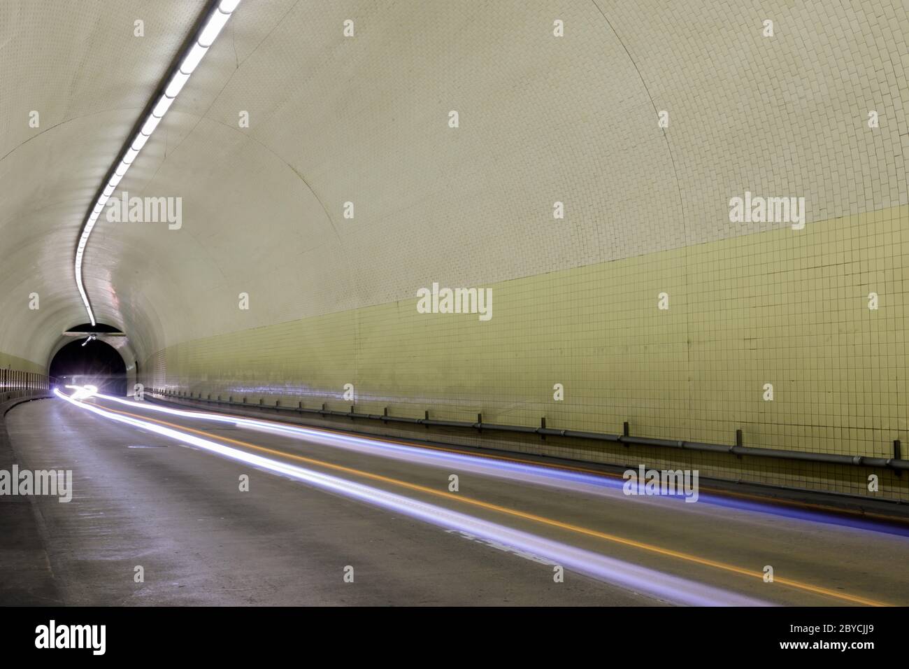 Car light trails inside Robert C Levy Tunnel (A.K.A. Broadway Tunnel) in San Francisco Stock Photo