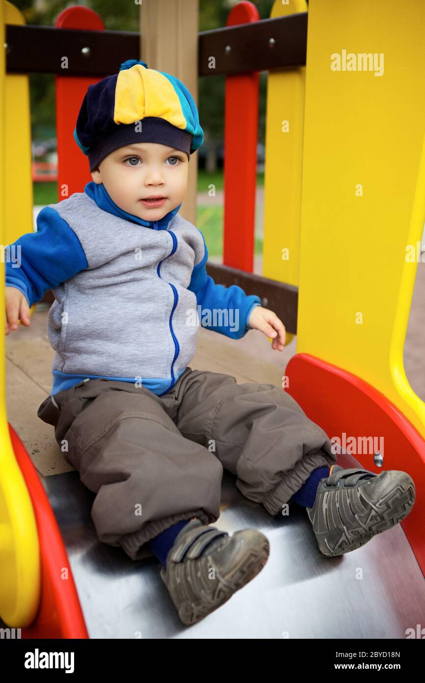Boy playing at playground hi-res stock photography and images - Alamy