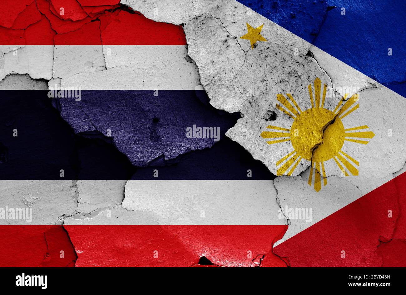 flags of Thailand and Philippines painted on cracked wall Stock Photo