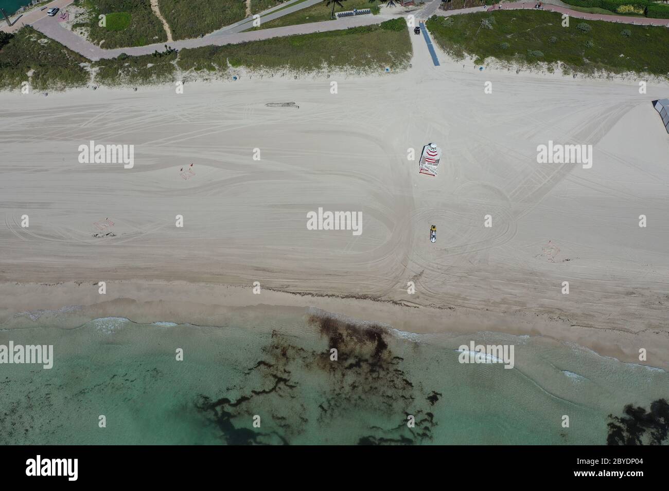Aerial overhead view of South Beach in Miami Beach, Florida during COVID-19 beach closure on sunny morning. Stock Photo