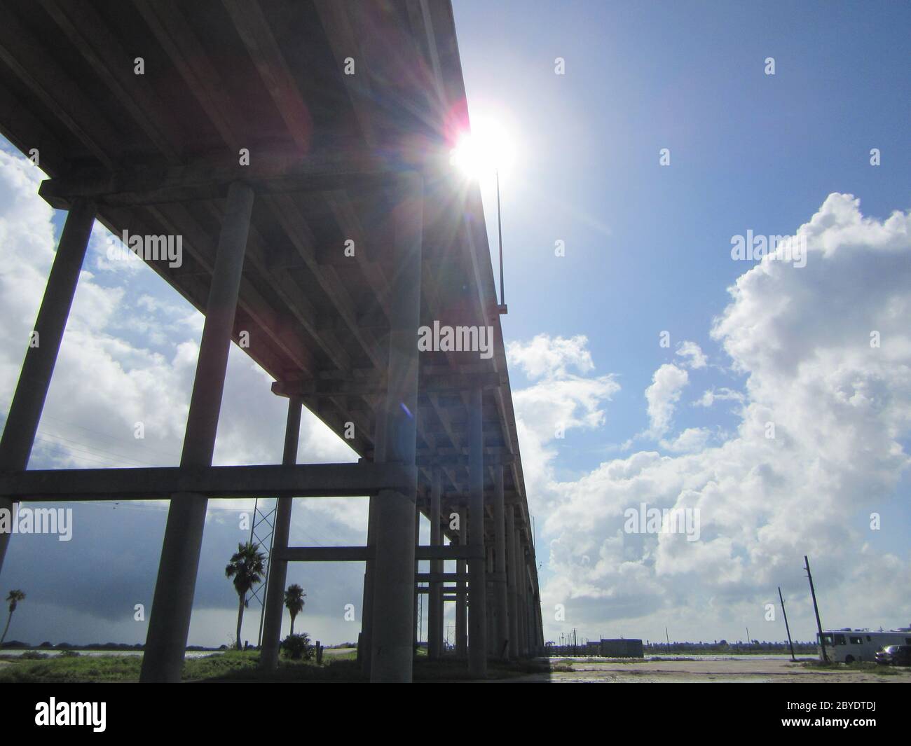 A perspective view from underneath a bridge over Laguna Madre, leaving the mainland of Corpus Christi, Texas and crossing over to Padre Island Stock Photo