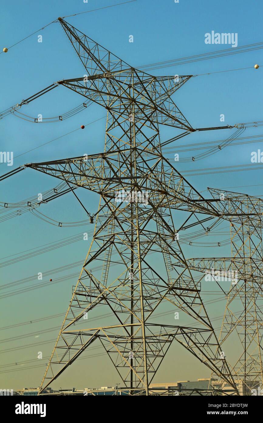 high voltage electric tower line with blue sky background Stock Photo ...