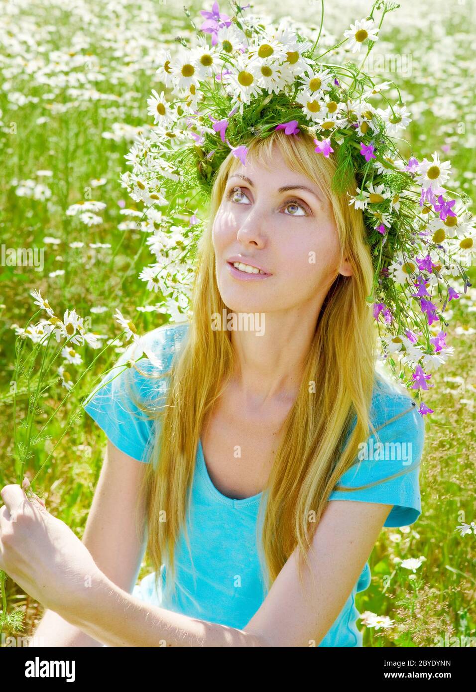 The happy young woman in a wreath Stock Photo