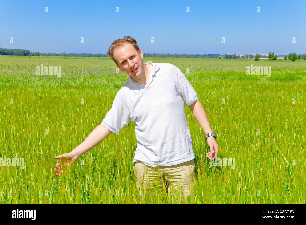 The smiling man in  the field Stock Photo