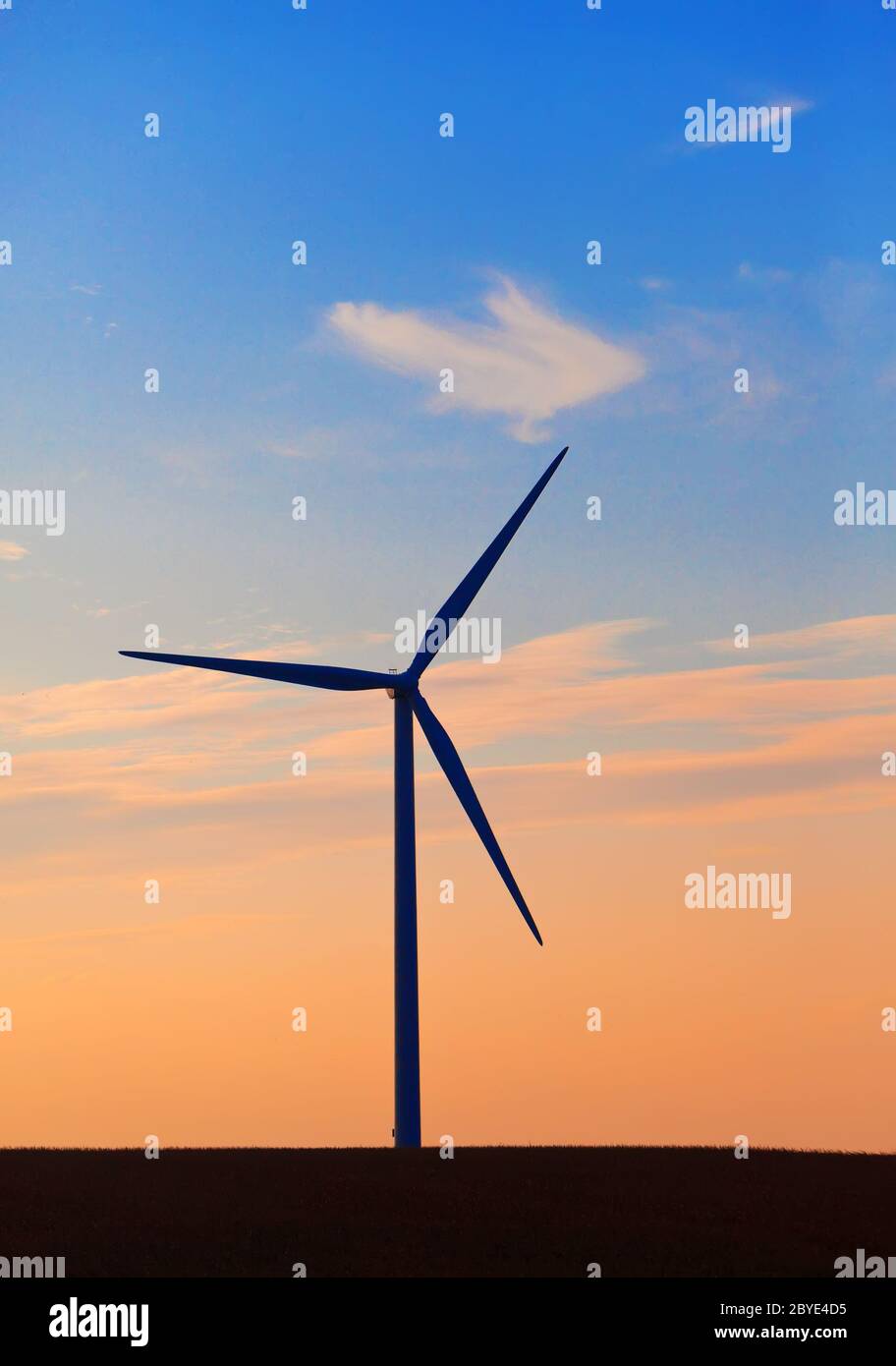 Silhouette of wind turbines against the sunset sky Stock Photo - Alamy