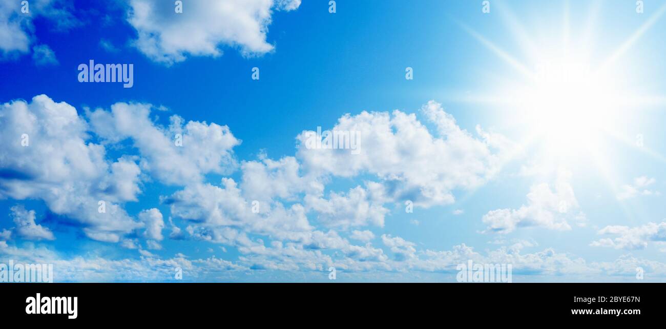 Blue sunny sky with clouds Stock Photo - Alamy