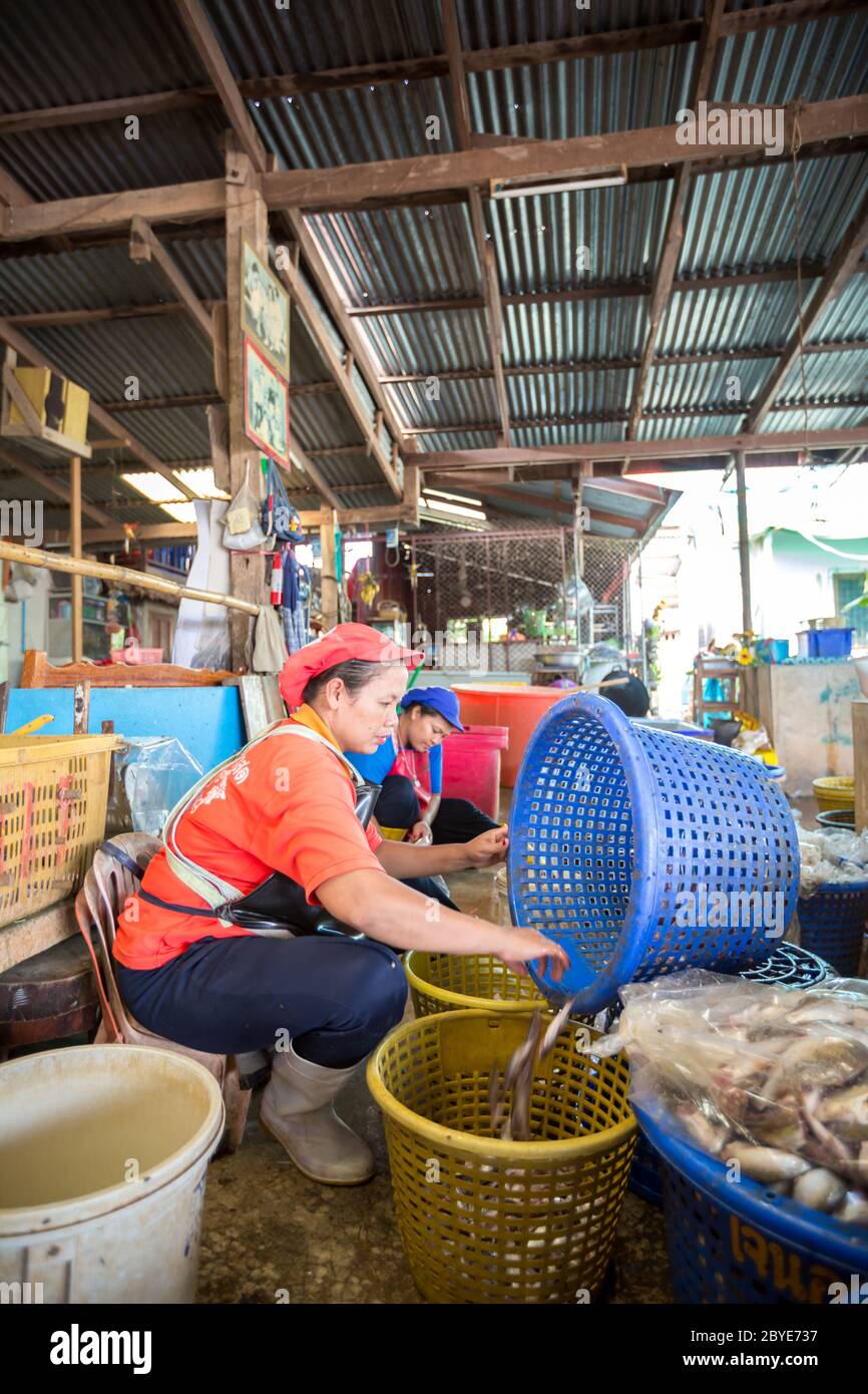 Fishermen working in fish market Stock Photo