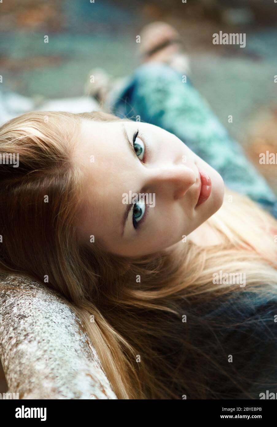 Young blond girl in autumn park in the evening Stock Photo - Alamy