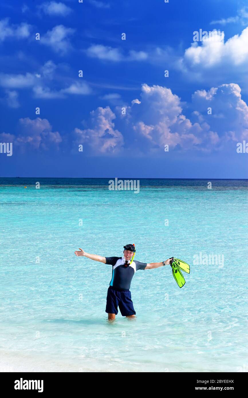 man in the sea with the equipment for a snorkeling Stock Photo