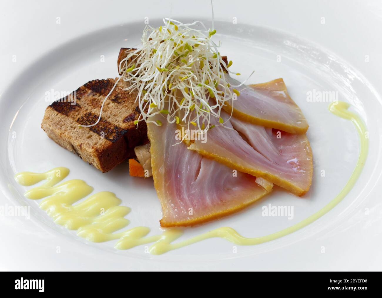 Slices smoked marlin and roasted bread on plate Stock Photo - Alamy