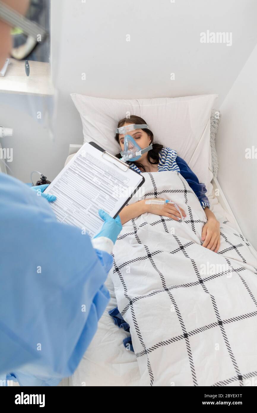 Morning hospital rounds of the attending physician. A young teenage