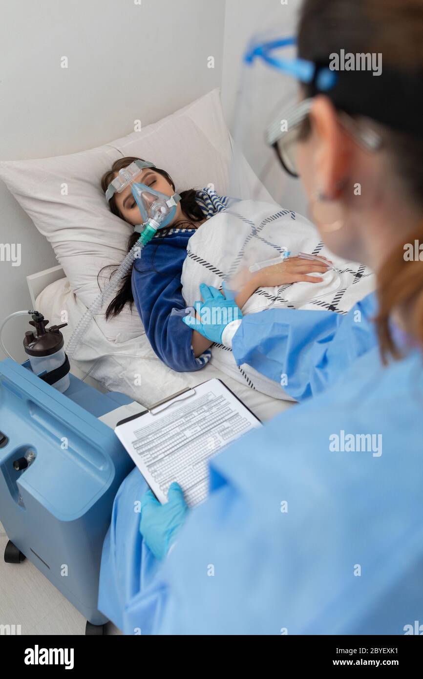 Morning hospital rounds of the attending physician. A young teenage