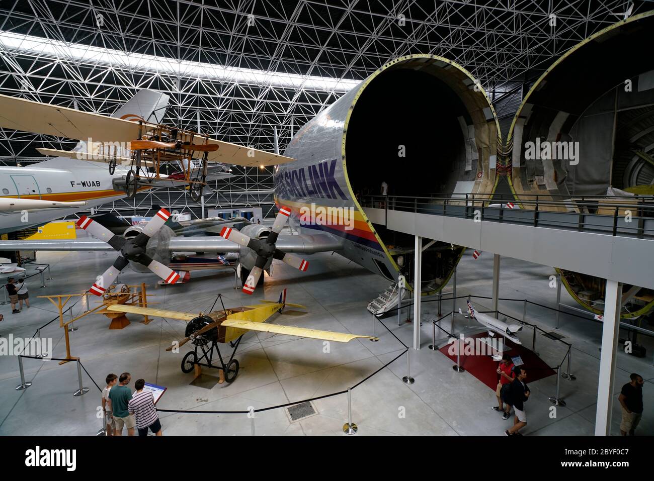 Historic airplanes and an Aero Spacelines/Airbus B-377 Super Guppy with open nose in Musee Aeroscopia Museum. Blagnac.Toulouse.Haute-Garonne.Occitanie.France Stock Photo