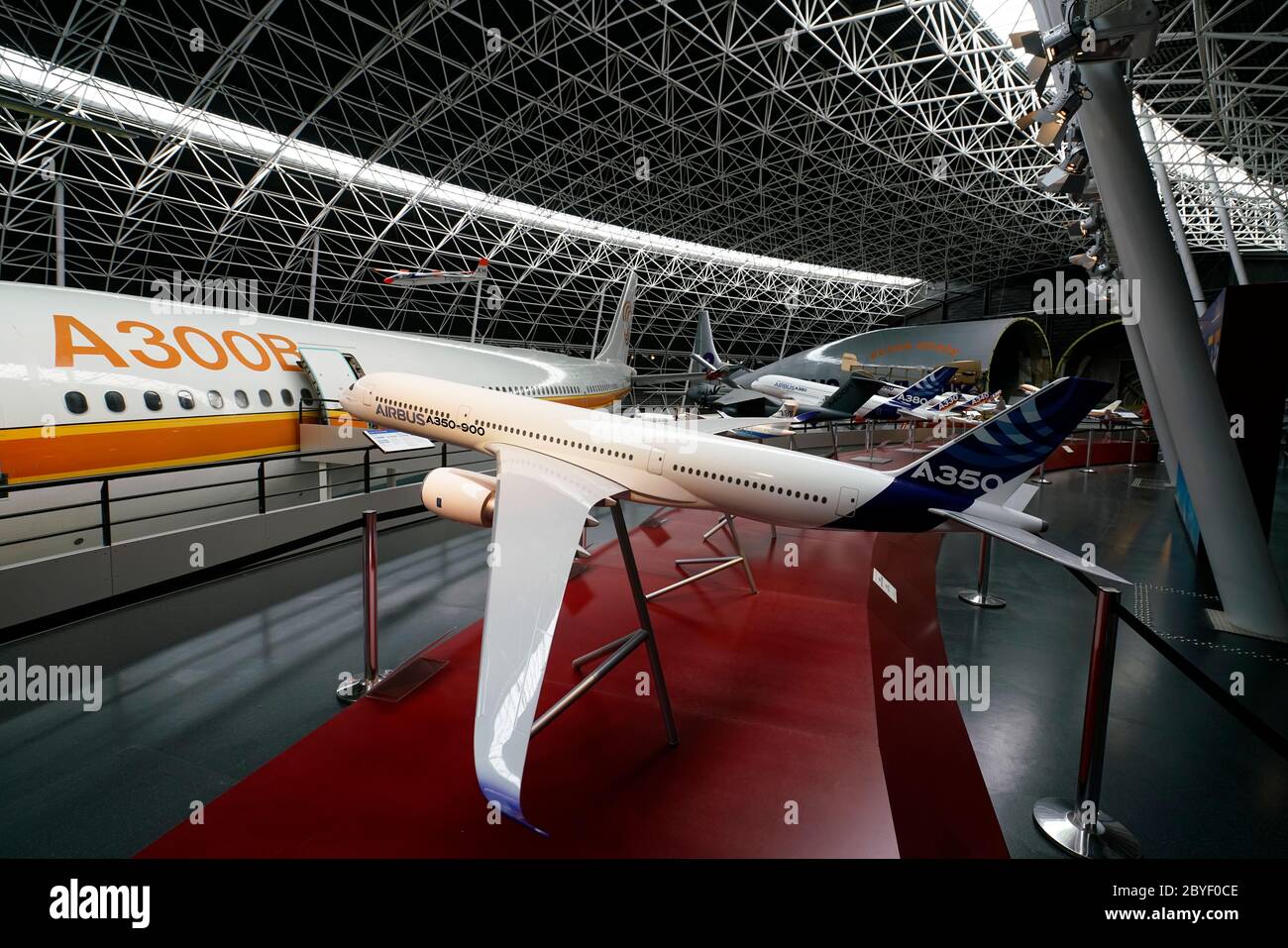 A model of Airbus A350 with an Airbus A300B wide-body airliner in background.Musee Aeroscopia Museum.Blagnac.Toulouse.Haute-Garonne.Occitanie.France Stock Photo