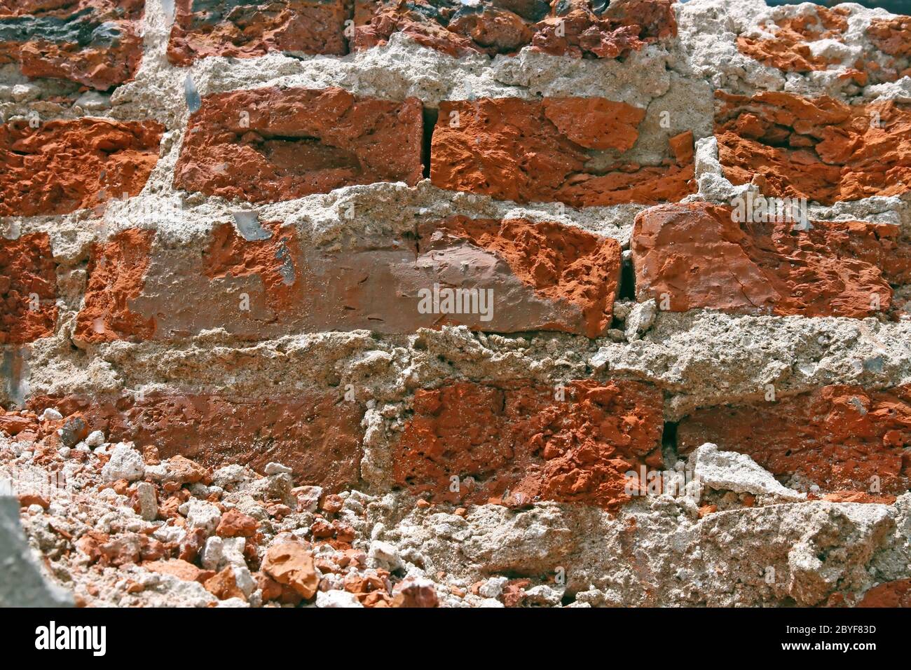 Cracking of Red Brick Wall Pattern Stock Photo