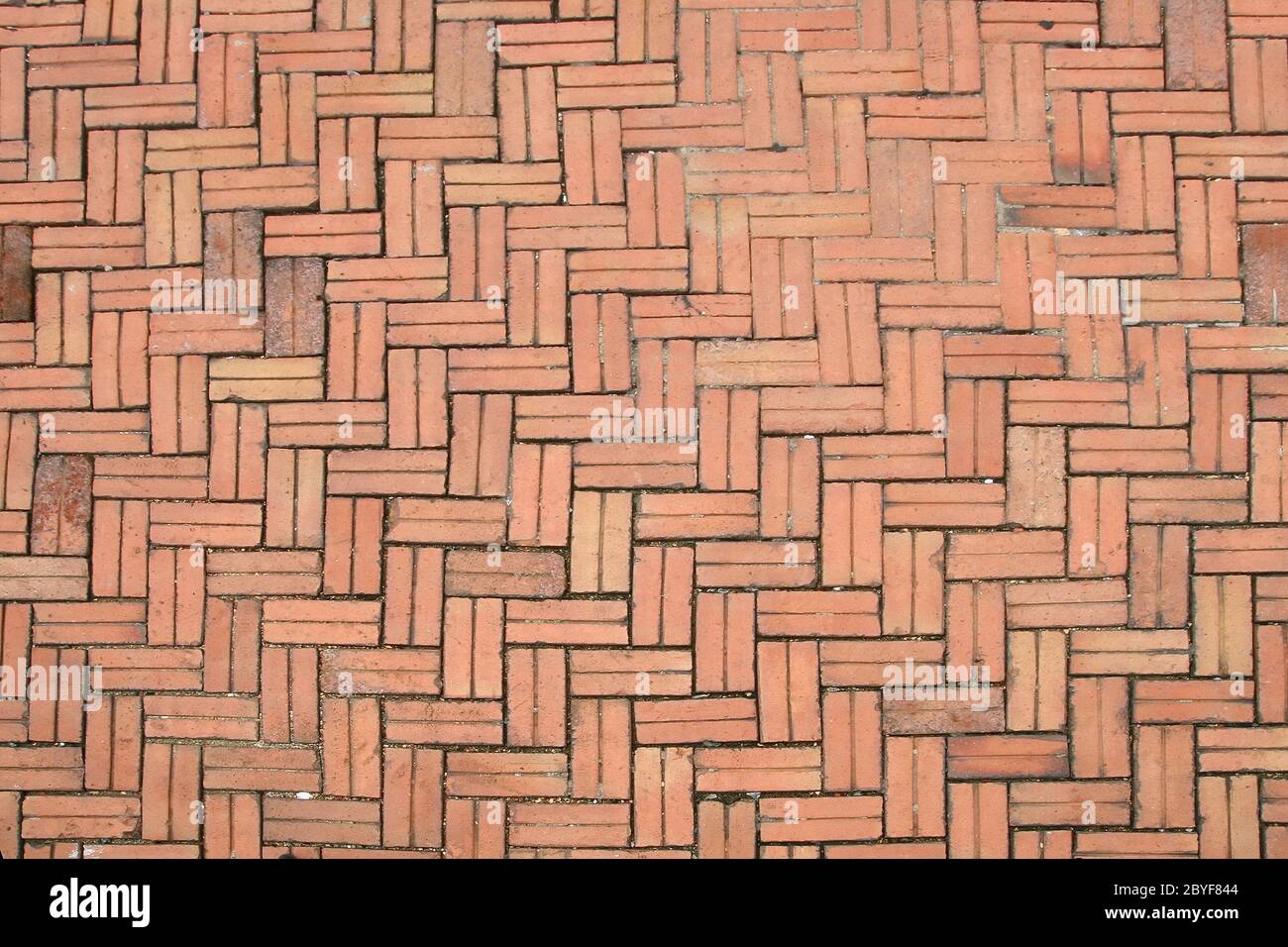 Pattern of Crossing Red Stone pavement Stock Photo