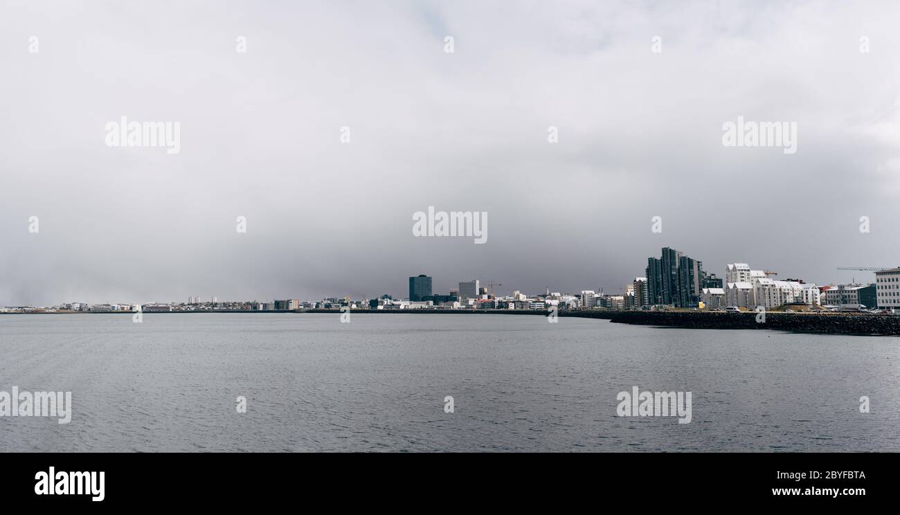 View of Multi-storey modern high-rise buildings on the waterfront in Reykjavik ...