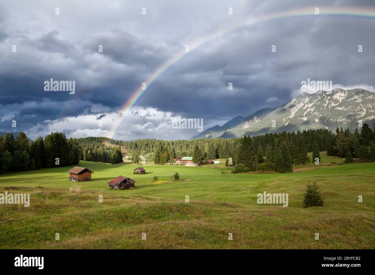 rainbow over Karwendel mountain range in Bavaria Stock Photo