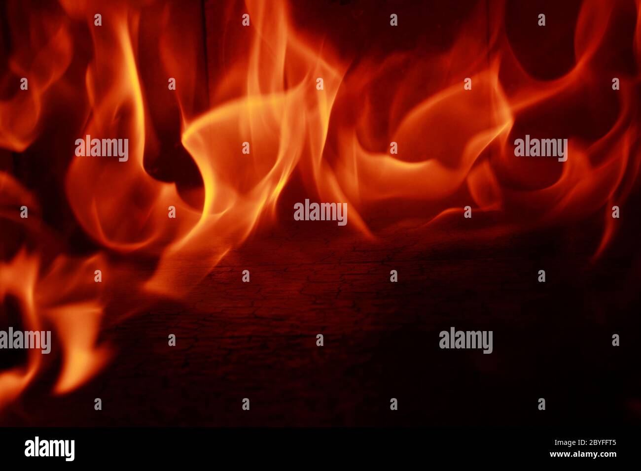 Fire flames with reflection on black background Stock Photo