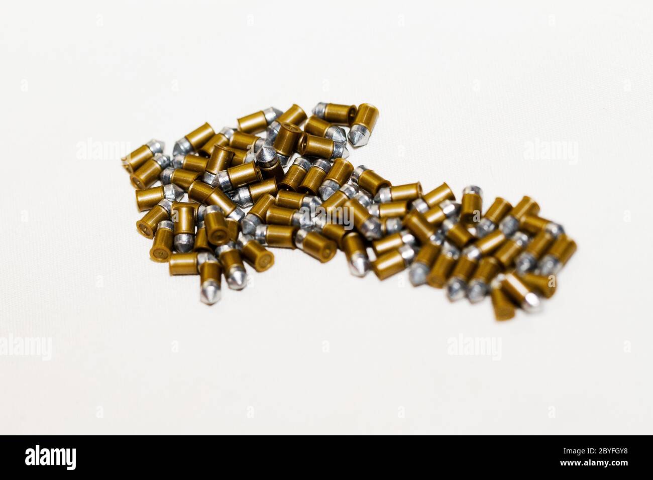 Gun bullets over white background in arrow formation Stock Photo Alamy