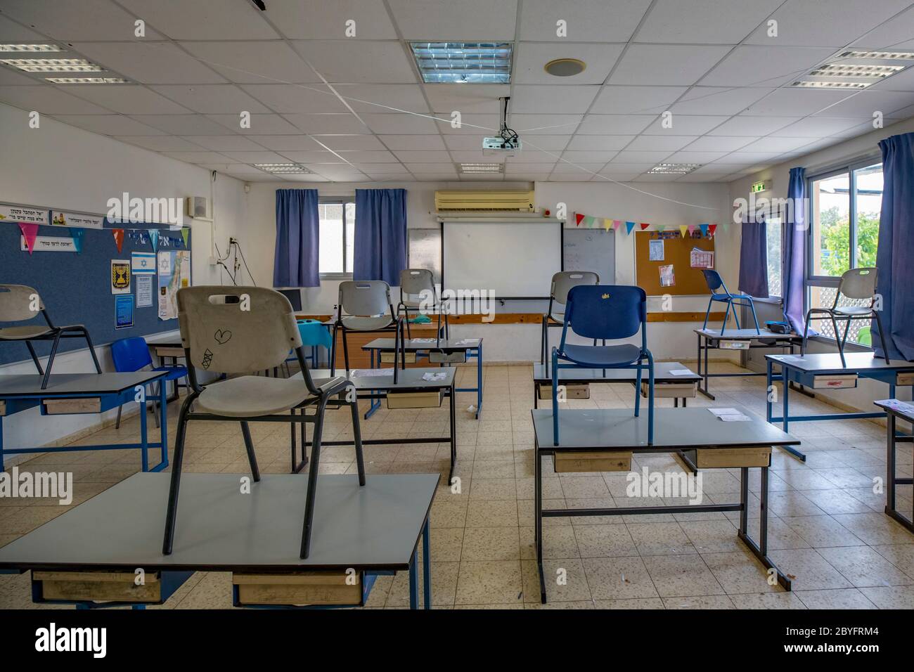 Schooling under COVID-19 Empty classroom at a Primary school. The outbreak of COVID-19 has forced governments around the world to impose a civil quara Stock Photo