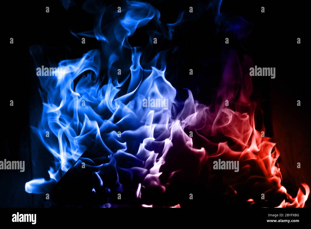 Blue and red flame isolated on dark background Stock Photo Alamy
