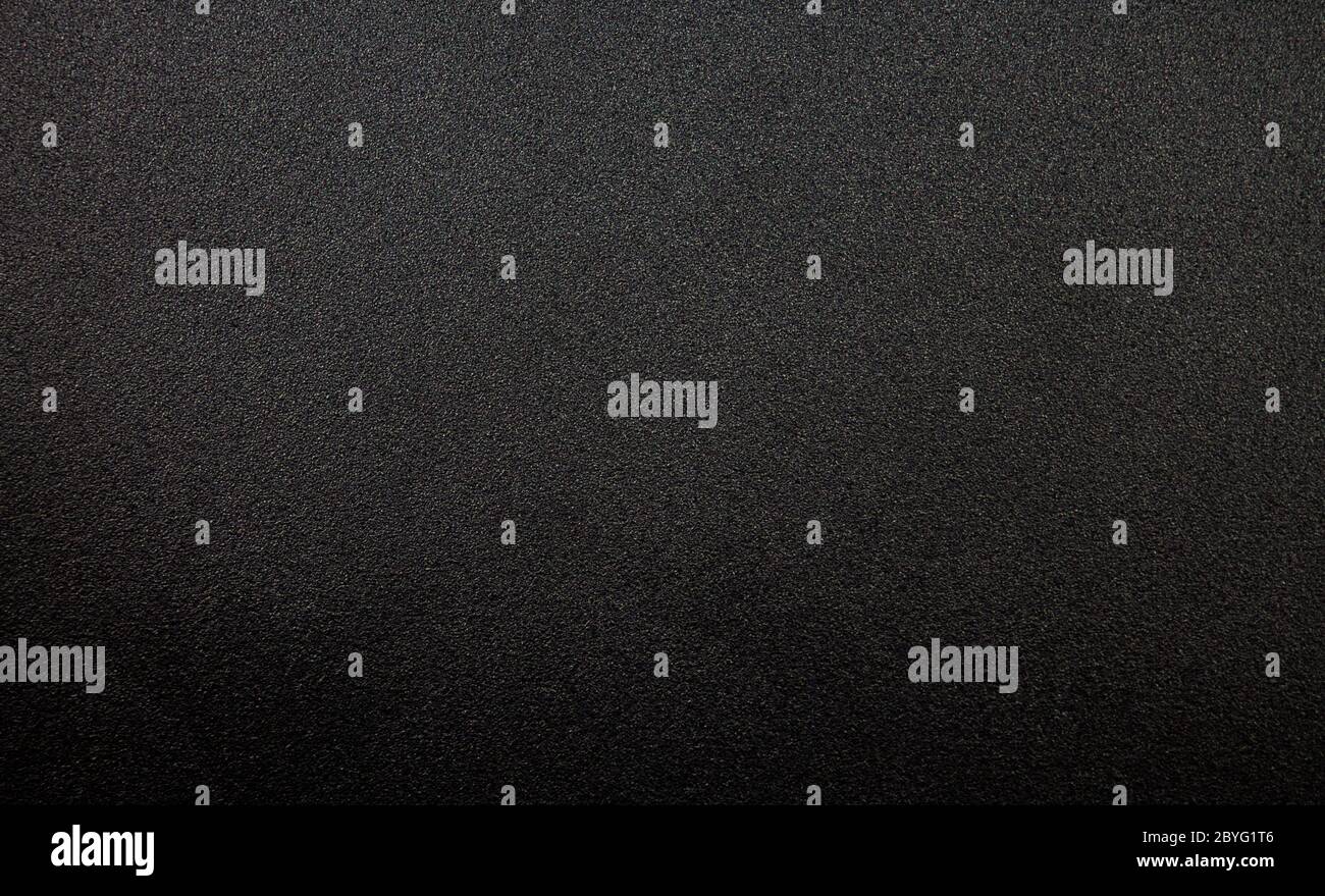 A metal plate texture in a black color. Stock Photo