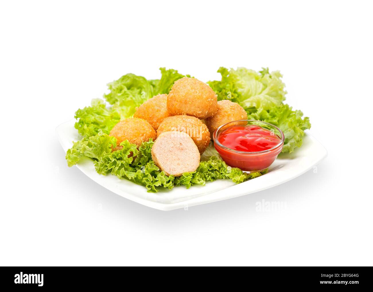 Hot Fried Crispy Chicken Nuggets in batter and sesame on a white plate