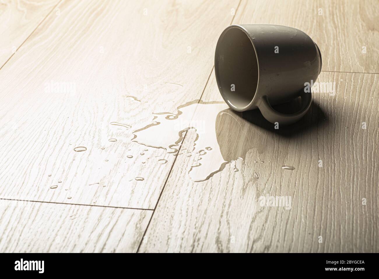 Laminate background.. Wooden laminate and parquet board with spilled water. Moisture protection