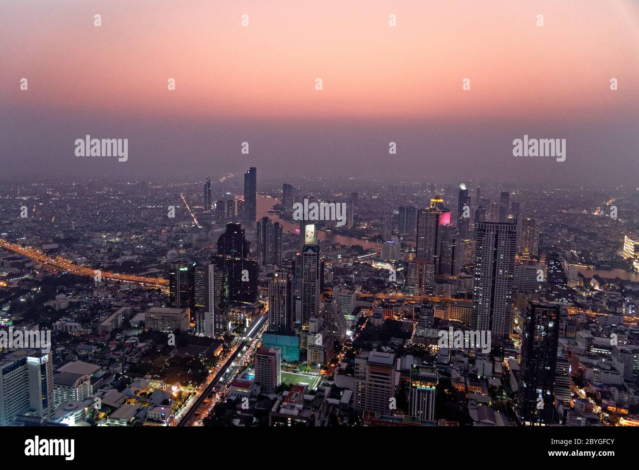 Scenic View Of Many Lit Skyscrapers And Other Buildings In Downtown ...