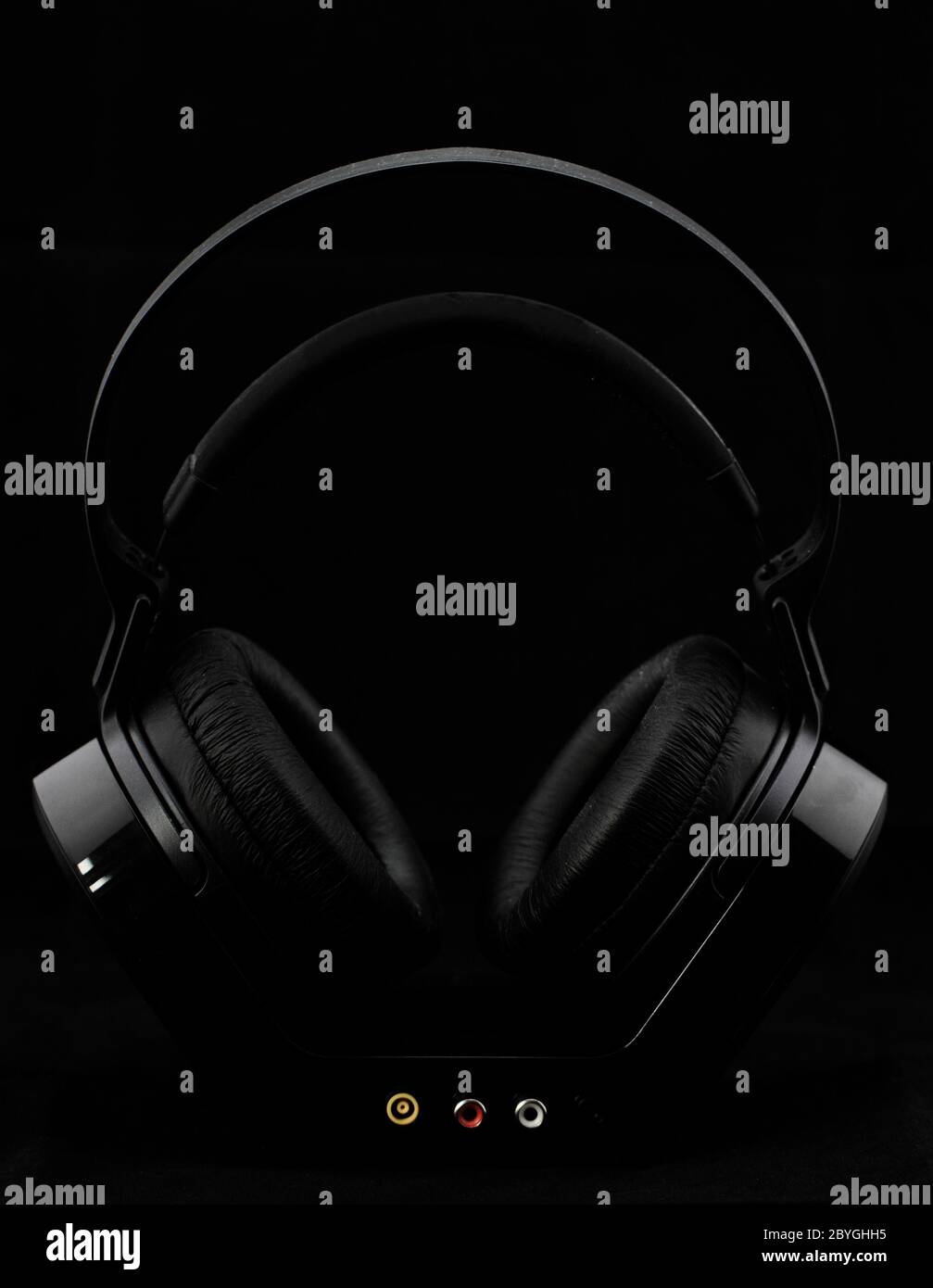Black modern Headphones on a black background Stock Photo - Alamy