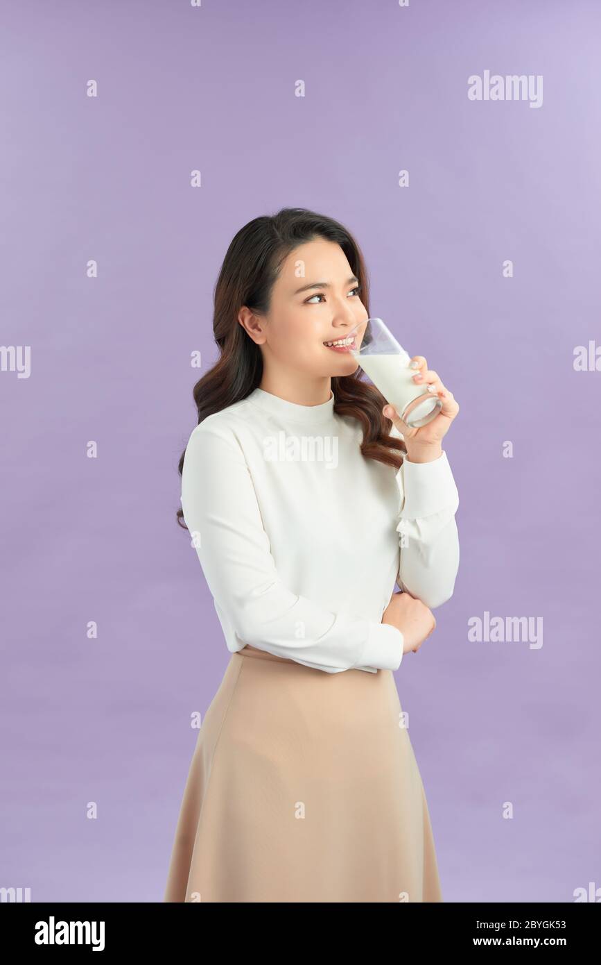 Young woman is drinking milk. Healthy nutrition Stock Photo Alamy