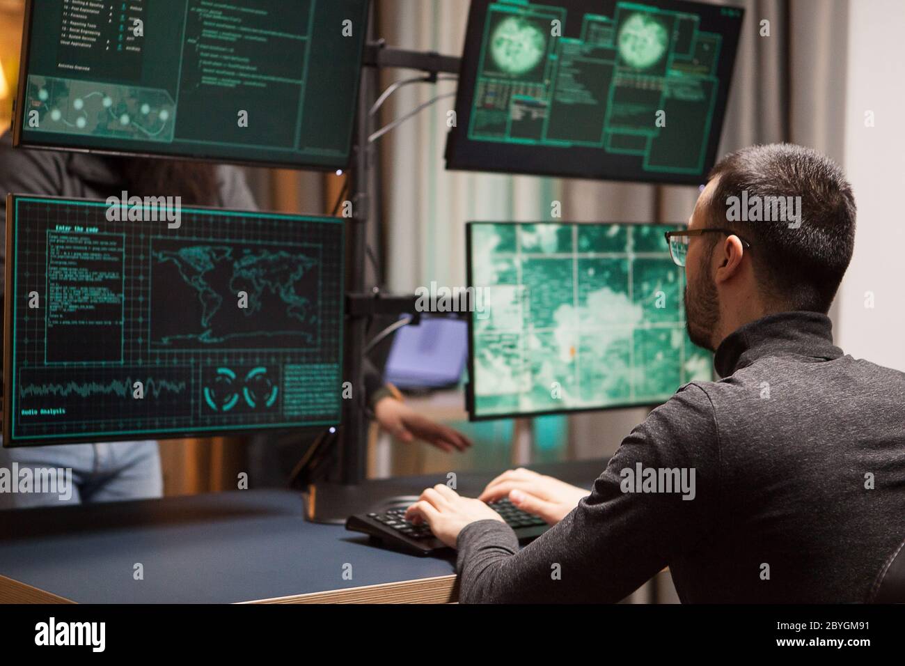 Hacker typing on futuristic computer hi-res stock photography and ...