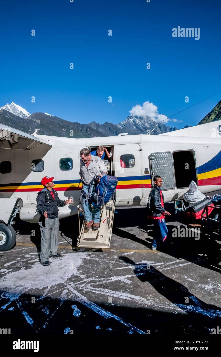 Nepal. Island Peak Trek. European trekkers arrive at the Lukla airfield and the main trading town of Lukla from where the majority of treks to Mount Everest start and finish Stock Photo