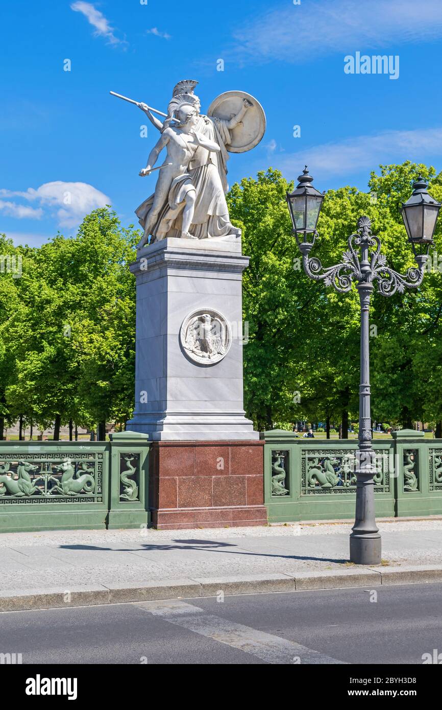 Sculptural group Athena Protects the Young Hero erected on the high marble pedestal and granite plinth installed on the bridge Schlossbruecke at Unter Stock Photo